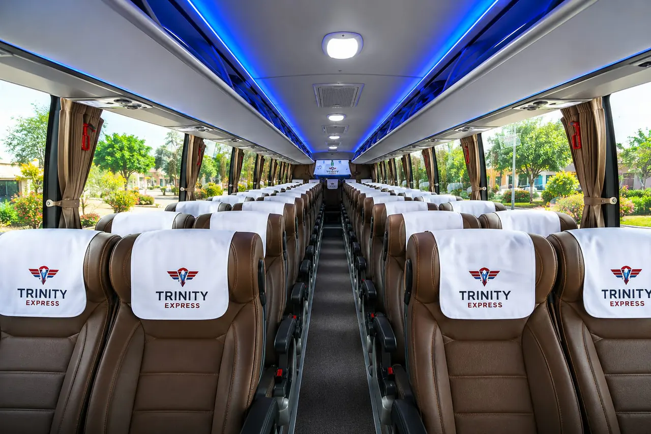 Trinity Express coach interior with central aisle and overhead lighting