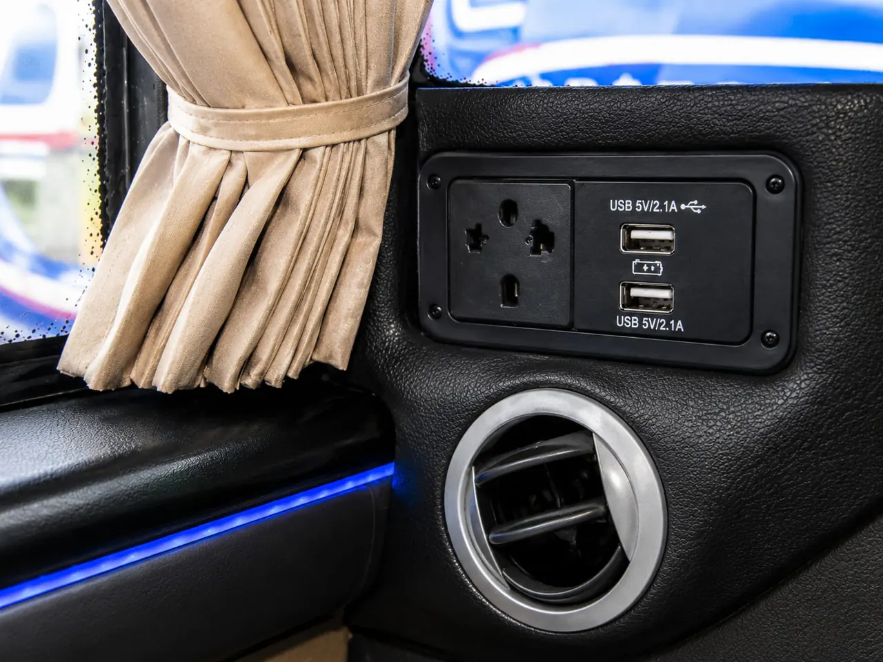 USB charging ports and power socket inside a Trinity Express coach